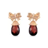 Enchanted Disney Fine Jewelry 14k Rose Gold 1/15 CTTW Diamond and Garnet Snow White Bow Earrings