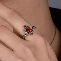 Enchanted Disney Fine Jewelry Black Rhodium over Sterling Silver Evil Queen with 1/10 CTTW Diamond and Red Garnet Dagger Ring