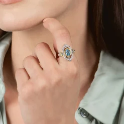 Enchanted Disney Fine Jewelry Sterling Silver and 10K Yellow Gold 1/5 CTTW Diamond and Swiss Blue Topaz Jasmine Ring