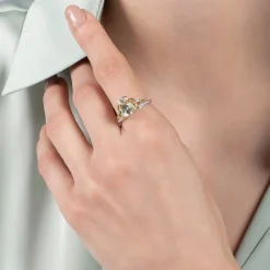 Enchanted Disney Fine Jewelry Sterling Silver and 10K Yellow Gold 1/10 CTTW Diamond and Concave Oval Green Amethyst Stepsisters Ring