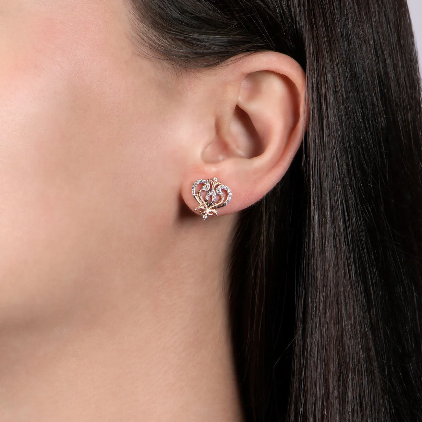 Enchanted Disney Fine Jewelry Sterling Silver and 10K Rose Gold with 1/10 CTTW Round White Diamond Anna Stud Earrings