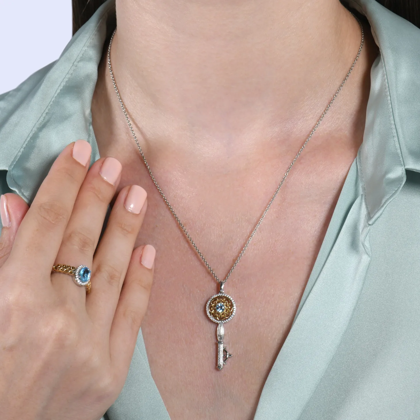 Enchanted Disney Fine Jewelry Sterling Silver and 10K Yellow Gold with 1/10 CTTW Diamond and Swiss Blue Topaz Brave 10th Anniversary Collectors Merida Halo Ring