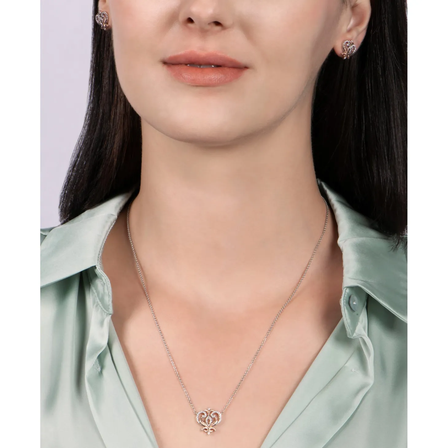 Enchanted Disney Fine Jewelry Sterling Silver and 10K Rose Gold with 1/10 CTTW Round White Diamond Anna Stud Earrings